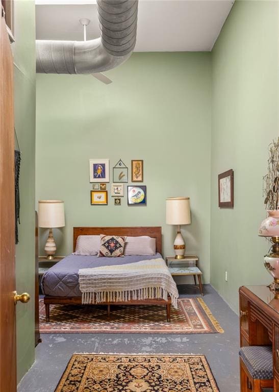 bedroom with unfinished concrete floors