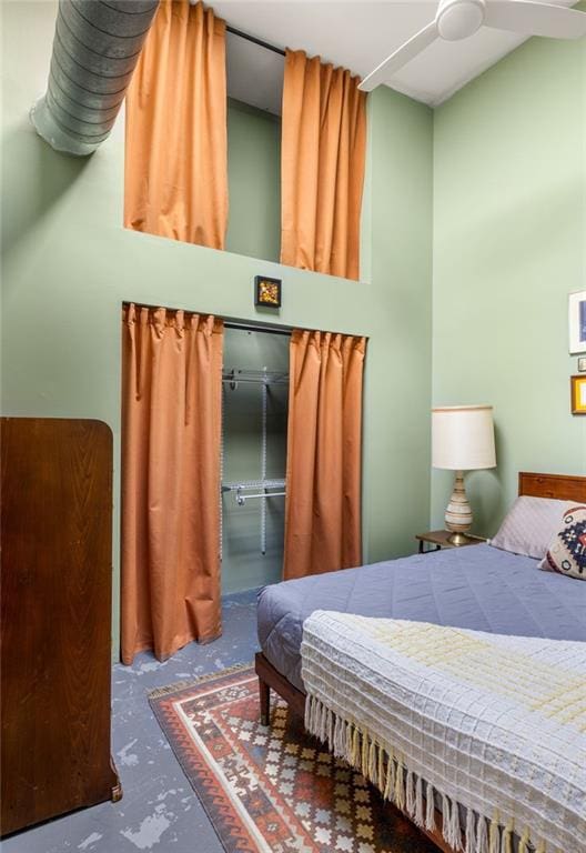 bedroom featuring concrete flooring