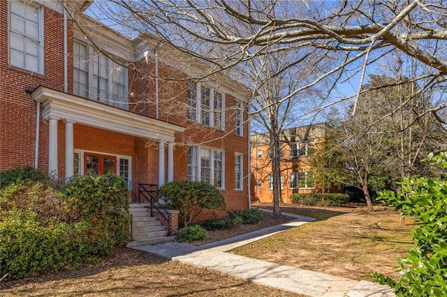 exterior space featuring brick siding