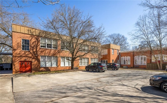 view of property featuring uncovered parking