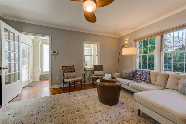 living room with crown molding, ceiling fan, and hardwood / wood-style flooring