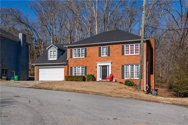 colonial house featuring a garage