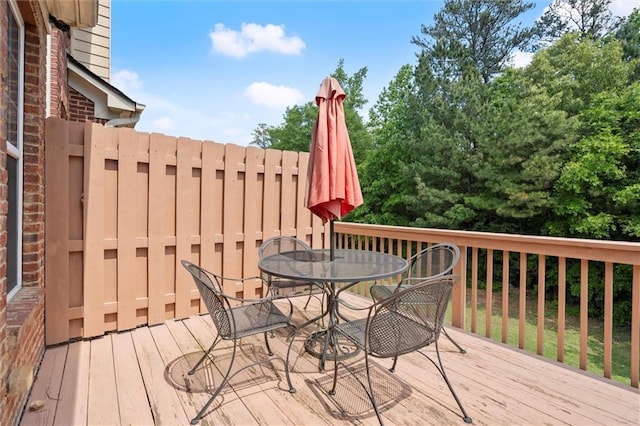 wooden terrace with outdoor dining space