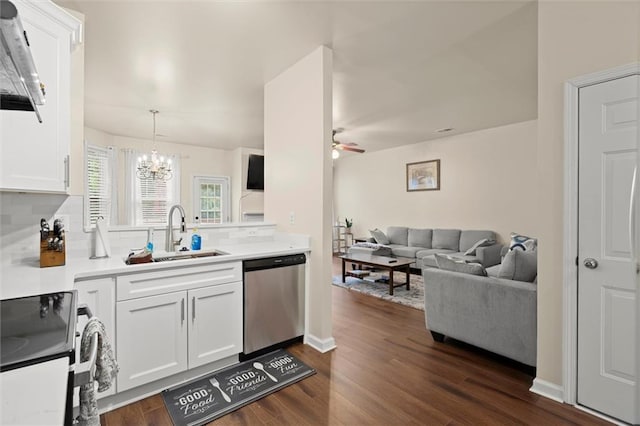 kitchen featuring stainless steel dishwasher, a sink, electric range oven, backsplash, and white cabinetry