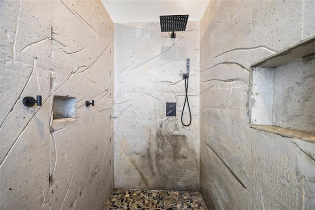 bathroom with a tile shower