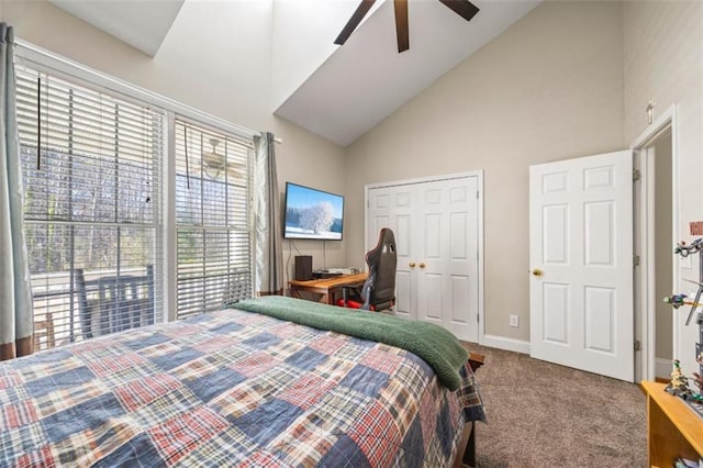 bedroom featuring ceiling fan, carpet floors, high vaulted ceiling, and a closet