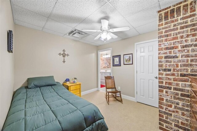 carpeted bedroom featuring a paneled ceiling and ceiling fan