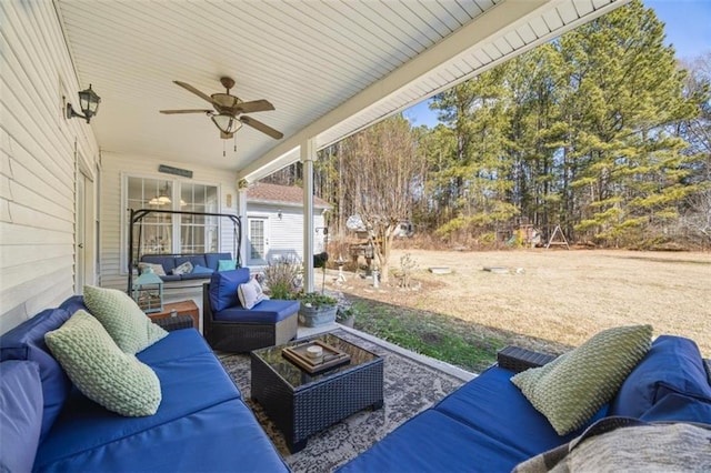 view of patio featuring an outdoor hangout area and ceiling fan