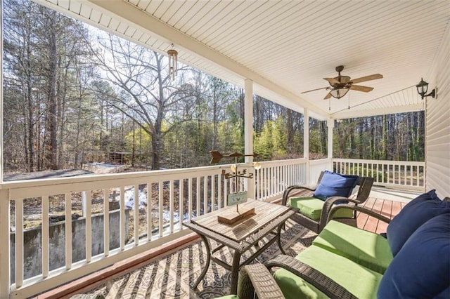 wooden deck with ceiling fan