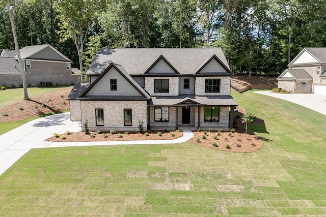 view of front of house featuring covered porch and a front lawn