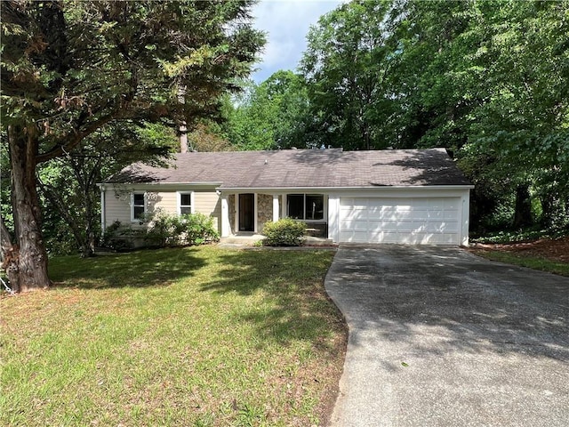 2705 Rhoanoke Dr, Duluth, GA 30096 - ranch-style home with concrete driveway, a front lawn, and a garage
