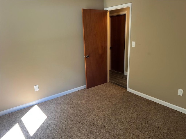 2705 Rhoanoke Dr, Duluth, GA 30096 - unfurnished room with baseboards and dark colored carpet