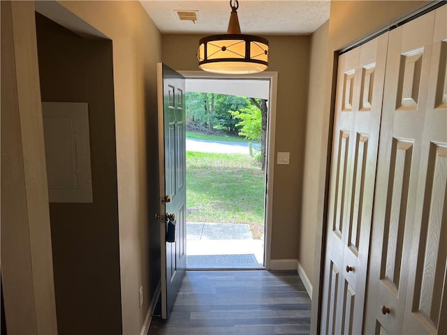 2705 Rhoanoke Dr, Duluth, GA 30096 - entryway with dark wood-style flooring, baseboards, visible vents, and electric panel