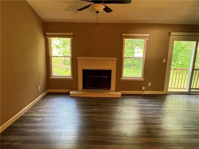 2705 Rhoanoke Dr, Duluth, GA 30096 - unfurnished living room with wood-type flooring, a ceiling fan, baseboards, and a fireplace with raised hearth