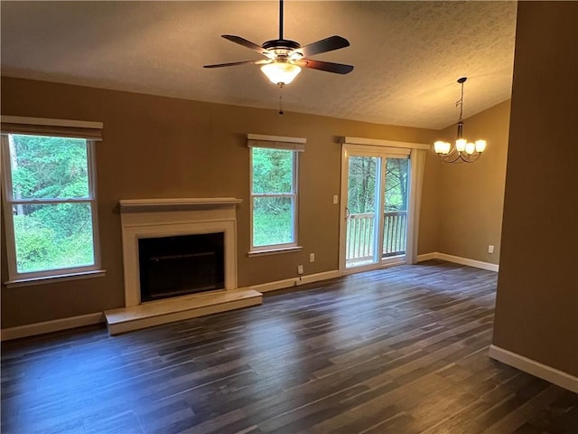 2705 Rhoanoke Dr, Duluth, GA 30096 - unfurnished living room with a textured ceiling, baseboards, a fireplace with raised hearth, ceiling fan with notable chandelier, and dark wood-style floors