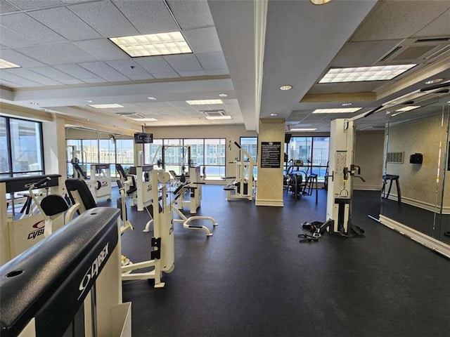 exercise room featuring a drop ceiling