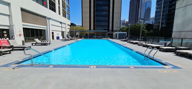 view of swimming pool with a patio