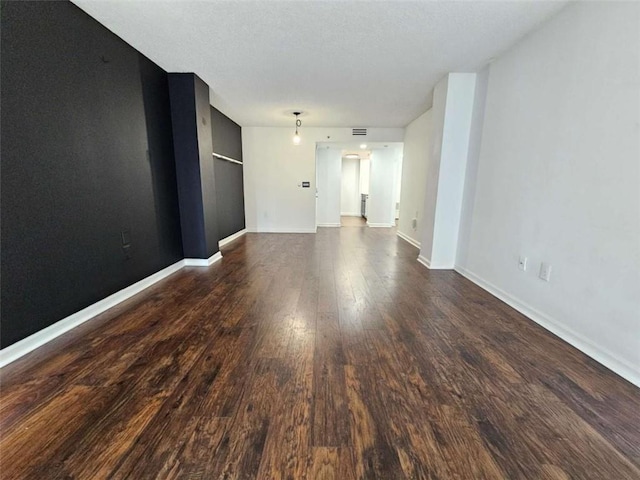 unfurnished room featuring dark hardwood / wood-style floors