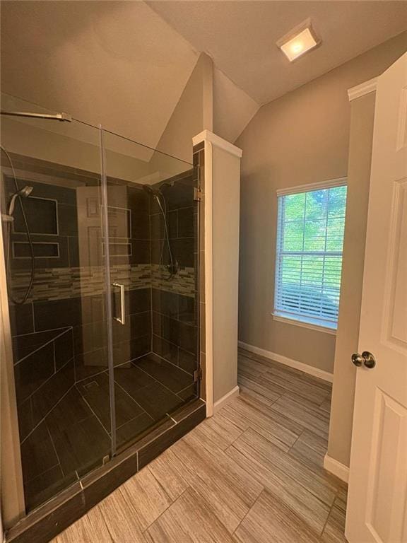 12 Barrington Ct, Sharpsburg, GA 30277 - bathroom featuring a stall shower and lofted ceiling