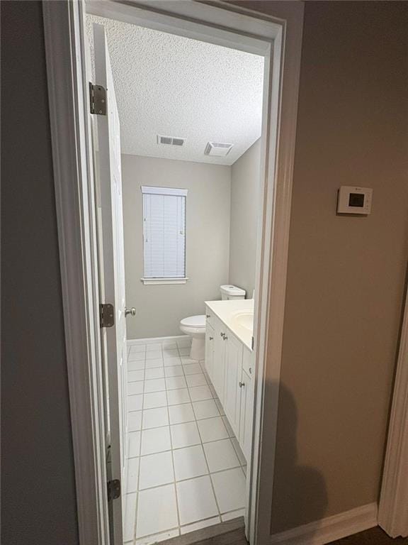 12 Barrington Ct, Sharpsburg, GA 30277 - bathroom with vanity, a textured ceiling, and tile patterned flooring
