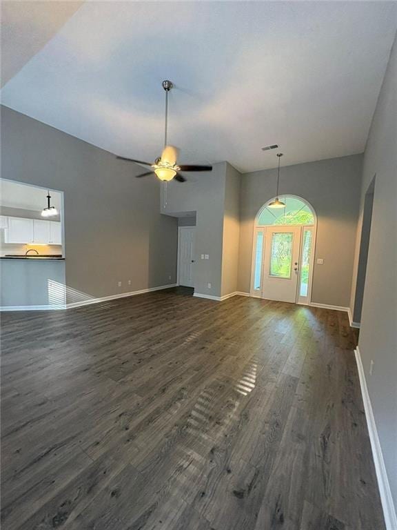 12 Barrington Ct, Sharpsburg, GA 30277 - unfurnished living room featuring dark wood finished floors and a ceiling fan