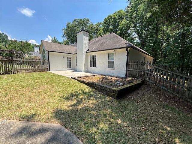 12 Barrington Ct, Sharpsburg, GA 30277 - rear view of house with a patio area, a fenced backyard, a chimney, stucco siding, and a shingled roof