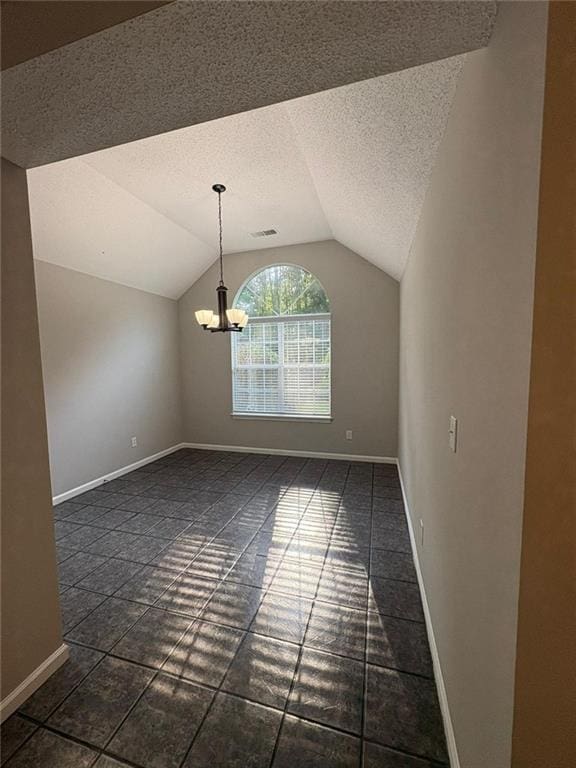 12 Barrington Ct, Sharpsburg, GA 30277 - unfurnished dining area featuring lofted ceiling, a textured ceiling, a chandelier, and dark tile patterned floors