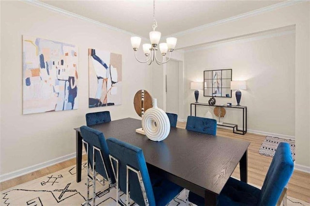 3064 Steinbeck Way, Atlanta, GA 30344 - dining area with a chandelier, baseboards, wood finished floors, and ornamental molding