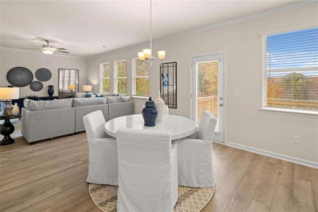 3064 Steinbeck Way, Atlanta, GA 30344 - dining area featuring a chandelier, healthy amount of natural light, light wood finished floors, ornamental molding, and a ceiling fan