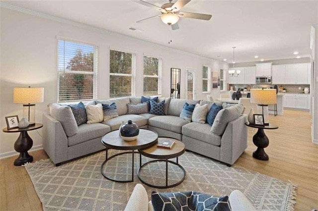 3064 Steinbeck Way, Atlanta, GA 30344 - living area with a ceiling fan, crown molding, a chandelier, light wood finished floors, and recessed lighting