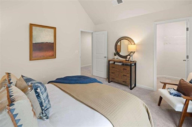 3064 Steinbeck Way, Atlanta, GA 30344 - bedroom featuring vaulted ceiling, light colored carpet, a spacious closet, and baseboards