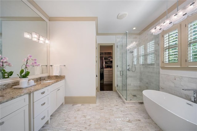 175 Centennial Trce, Roswell, GA 30076 - bathroom featuring a shower stall, vanity, a freestanding bath, and a walk in closet