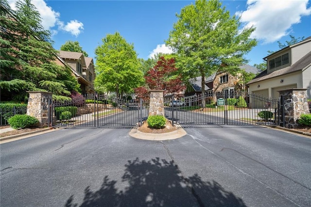 175 Centennial Trce, Roswell, GA 30076 - view of asphalt road with a gate, a gated entry, a residential view, and curbs