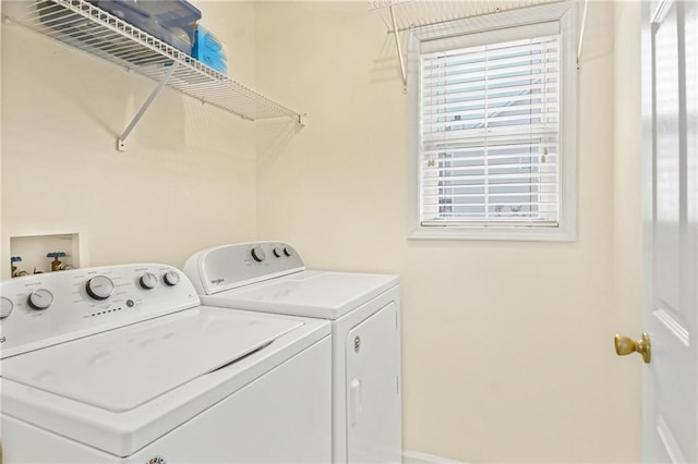 washroom featuring washing machine and dryer and laundry area