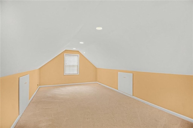 bonus room with baseboards, vaulted ceiling, carpet flooring, and recessed lighting