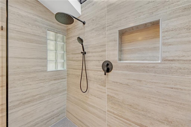 bathroom with wooden walls and tiled shower