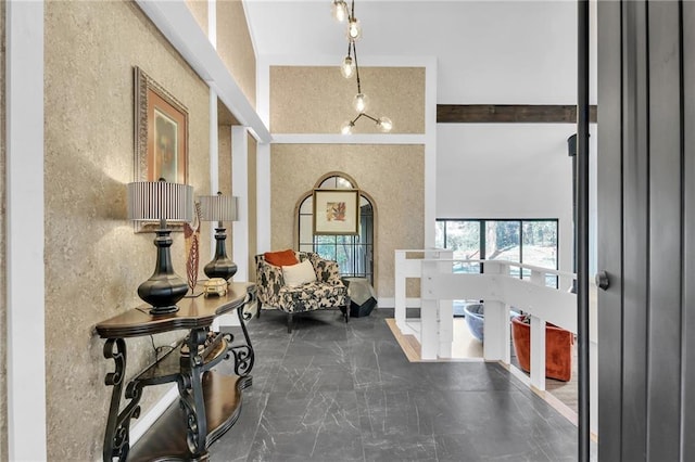 foyer entrance with a towering ceiling