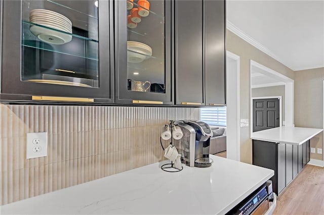 kitchen featuring light hardwood / wood-style floors and crown molding