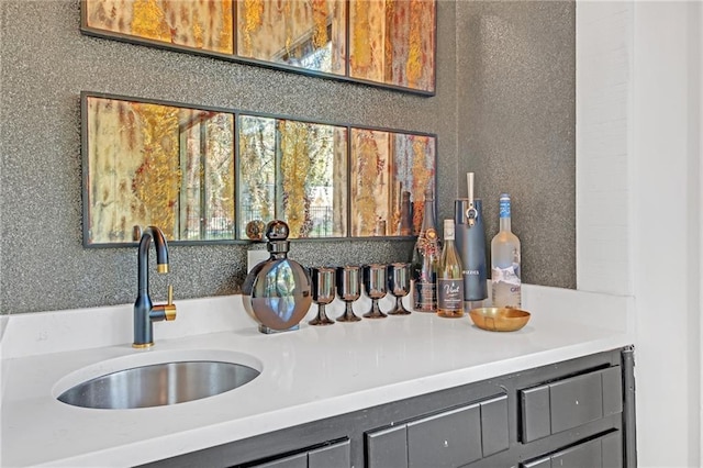 interior space featuring gray cabinetry and sink