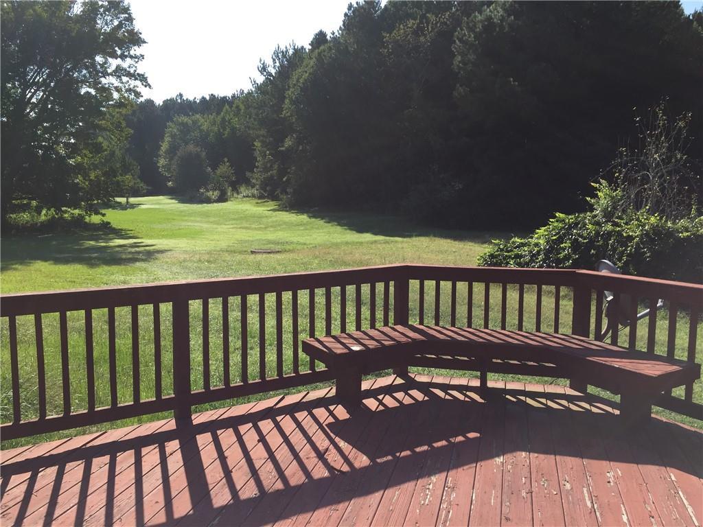 wooden deck with a yard