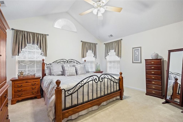 carpeted bedroom featuring ceiling fan and vaulted ceiling