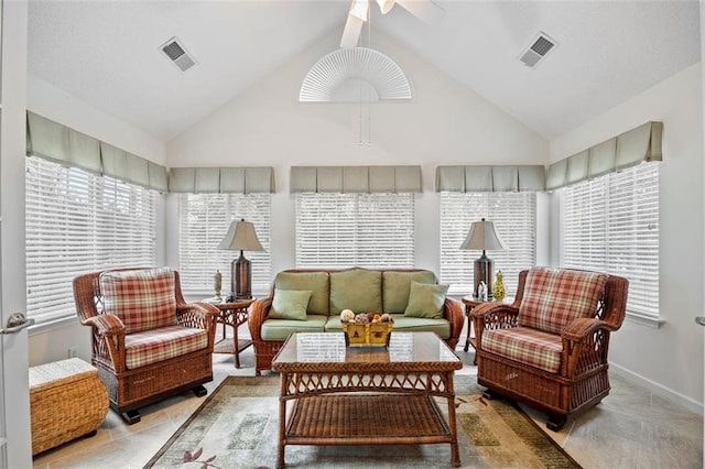 sunroom featuring ceiling fan and lofted ceiling