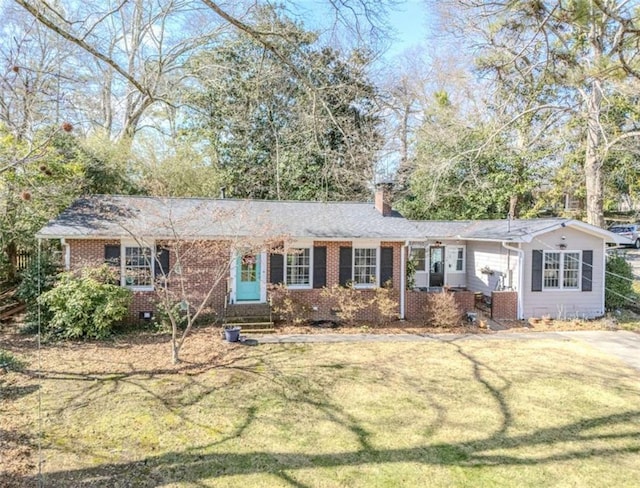 ranch-style house with a front yard