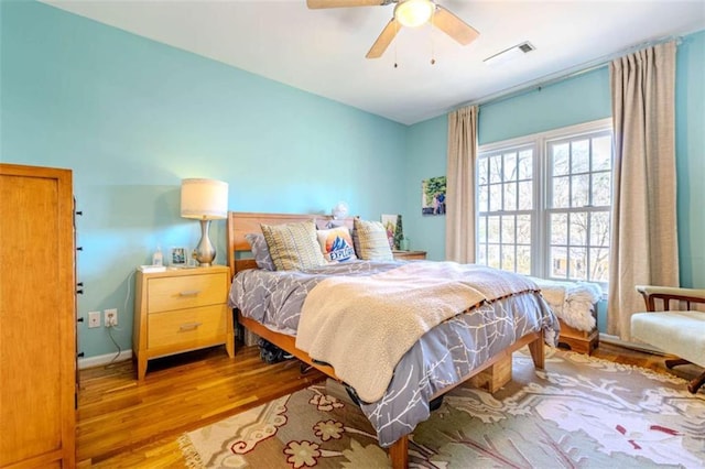 bedroom featuring ceiling fan and light hardwood / wood-style flooring