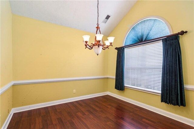 99 Rainwater Ln, Dallas, GA 30157 - spare room with a chandelier, wood finished floors, vaulted ceiling, and baseboards