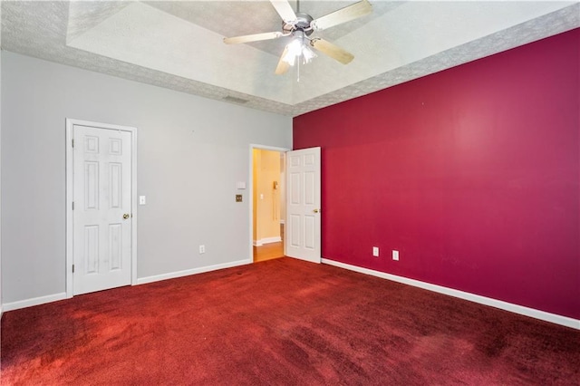 99 Rainwater Ln, Dallas, GA 30157 - carpeted empty room featuring baseboards, a ceiling fan, a raised ceiling, and a textured ceiling