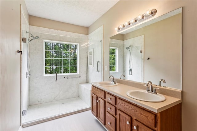 99 Rainwater Ln, Dallas, GA 30157 - full bath featuring a shower stall, double vanity, and a textured ceiling