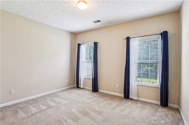 99 Rainwater Ln, Dallas, GA 30157 - empty room featuring carpet flooring, plenty of natural light, a textured ceiling, and baseboards