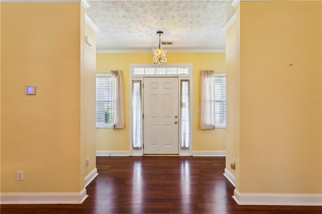 99 Rainwater Ln, Dallas, GA 30157 - foyer entrance featuring wood finished floors, ornamental molding, baseboards, and a chandelier