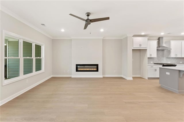 1987 Deco Dr, Kennesaw, GA 30144 - unfurnished living room featuring a ceiling fan, light wood-style floors, ornamental molding, recessed lighting, and a glass covered fireplace